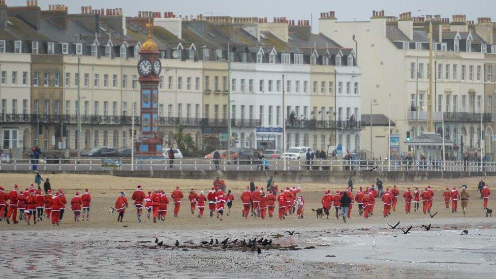 Chase The Pudding Santa Run on Weymouth beach