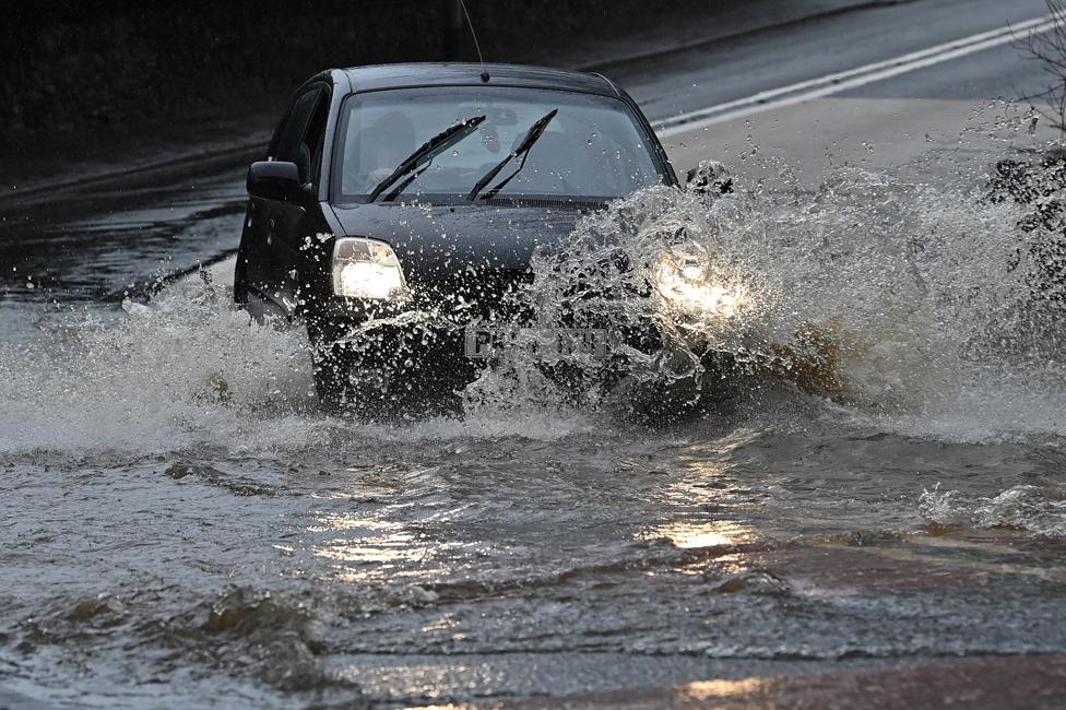 A car drives through flood water in Strines, on 20 January 2021