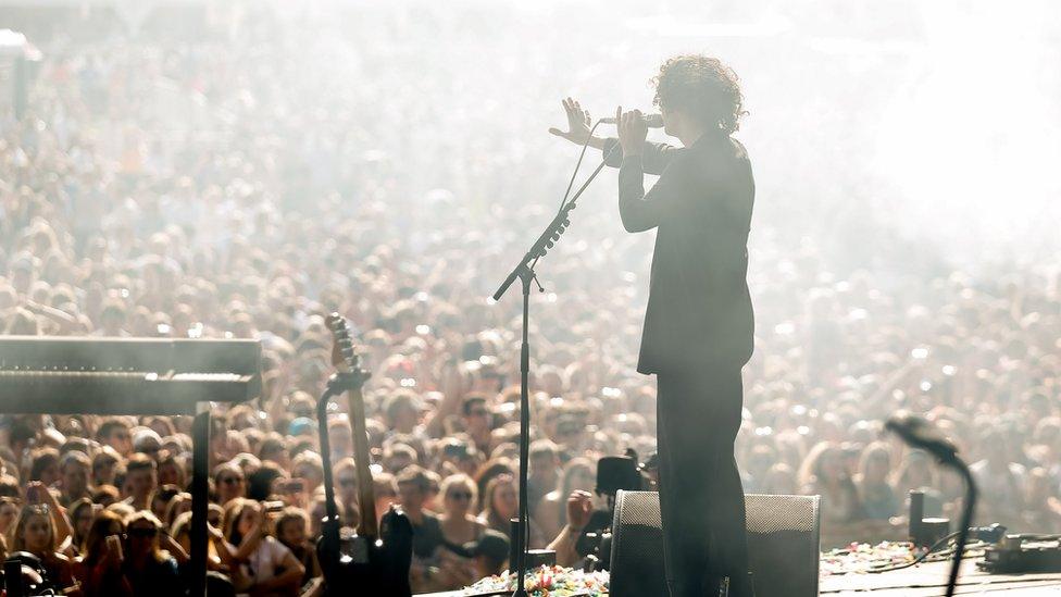 Matt Healy in front of a large audience