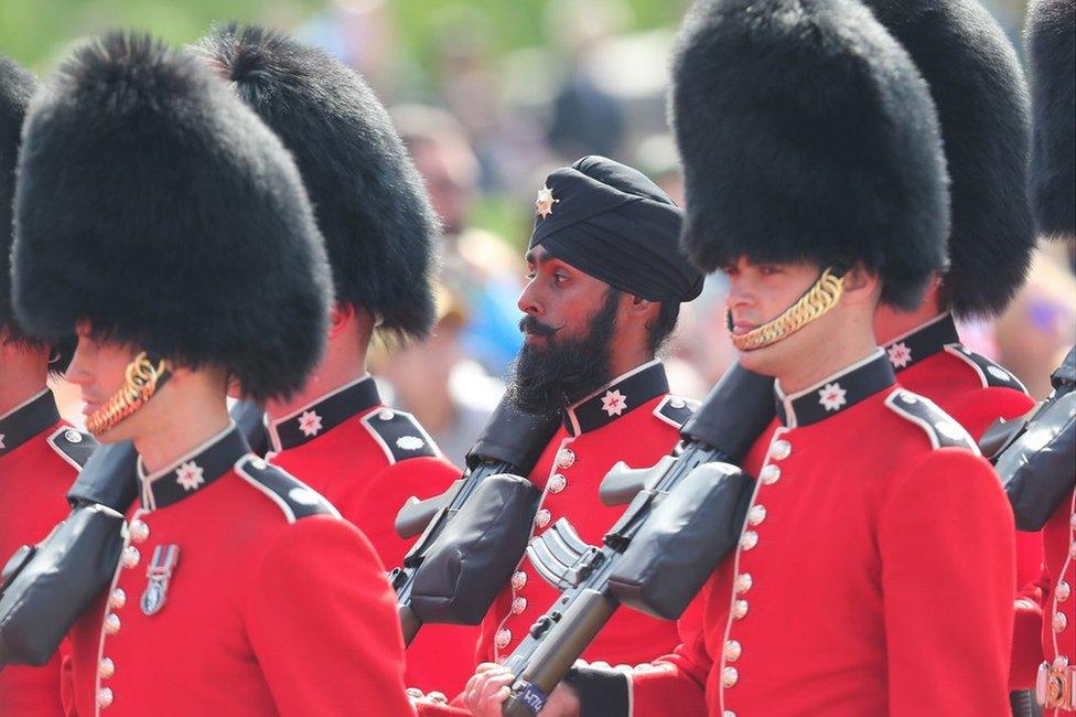 Coldstream Guardsman Charanpreet Singh Lall marches during Trooping The Colour parade