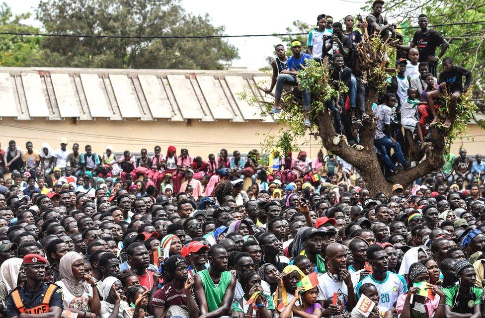 Senegalese supporters watch the Senegal v Colombia match on a giant screen at a fanzone in Dakar, Senegal - Thursday 28 June 2018