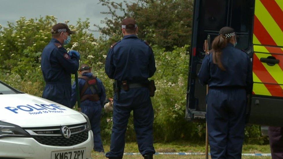 Officers carrying out searches