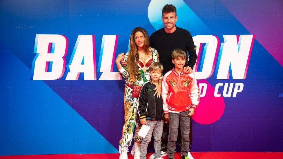 Shakira, Gerard Pique and his sons posing at the Balloons world cup.