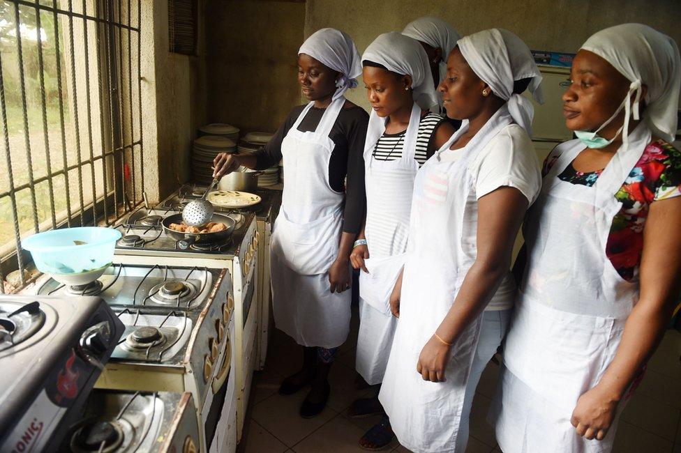 Women learn to cook at a non-governmental organisation in Benin, Nigeria