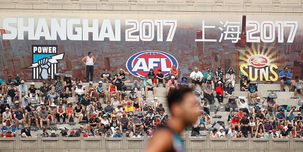 Fans look on at Shanghai's Jiangan Stadium.