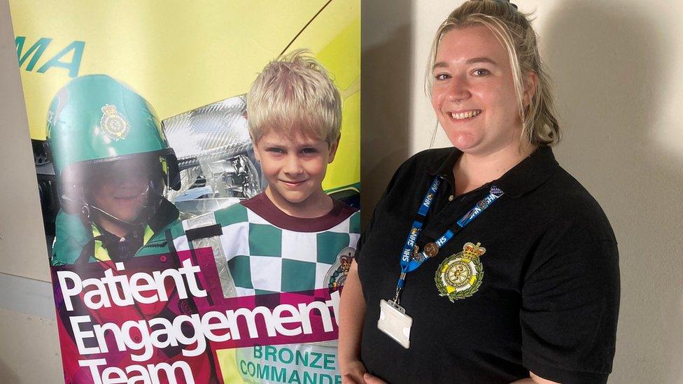 Deanne Hill from South Western Ambulance Service stood next to a patient engagement team banner