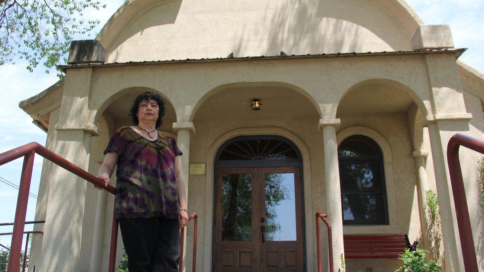 Rosa in front of the church