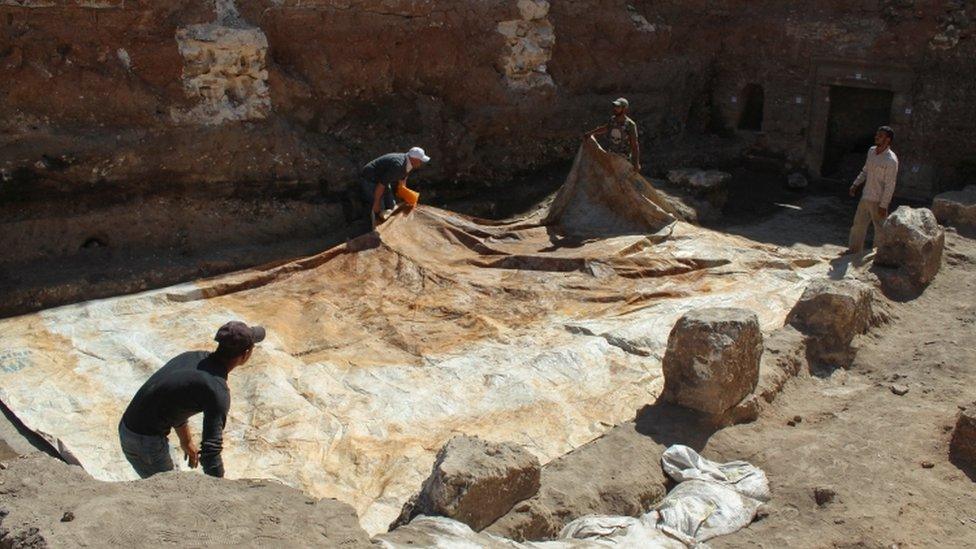 Mosaic being covered