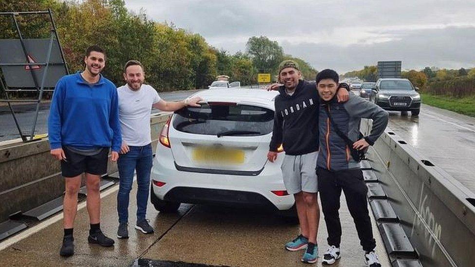 Men with a car on the A11