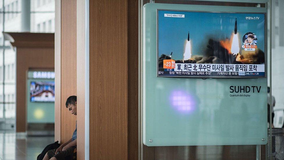 A television screen broadcasts news coverage of a North Korean rocket launch, at Seoul station on June 22, 2016.