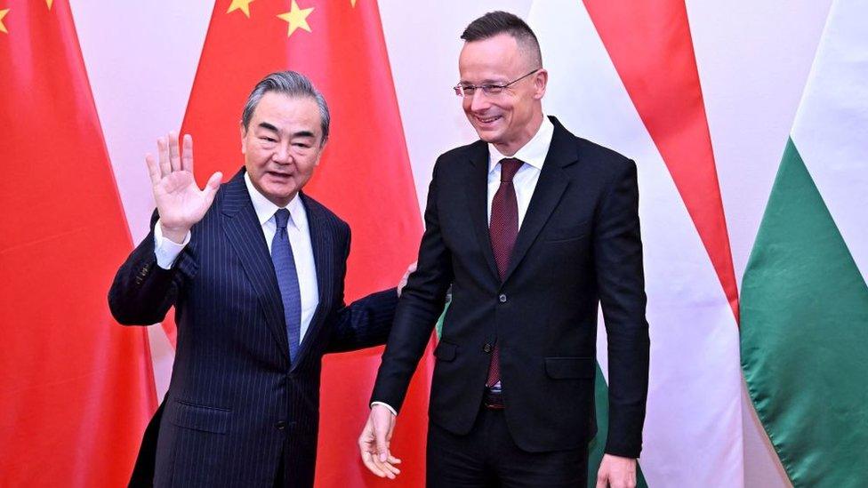 Hungarian Foreign and Trade Minister Peter Szijjarto (R) welcomes Senior Chinese diplomat Wang Yi for a meeting in Budapest, Hungary, on February 20, 2023