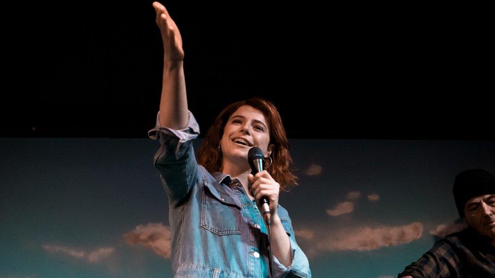 Jessie Buckley performing