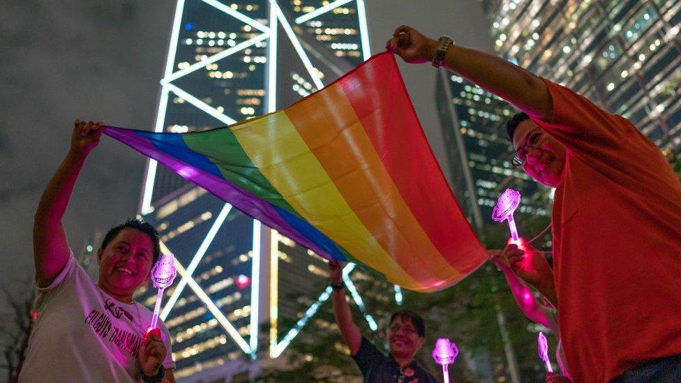 LGBT supporters hold a rainbow flag in Hong Kong