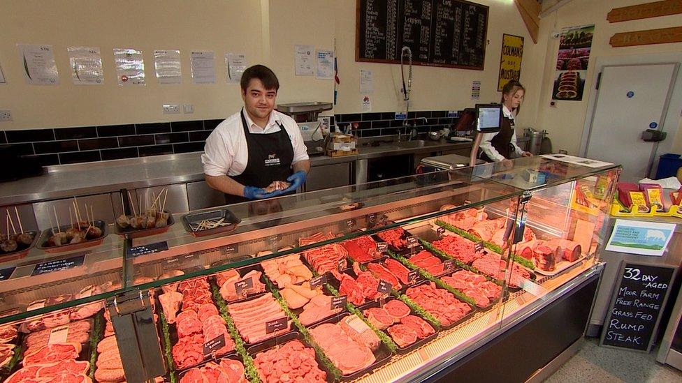 Nathan Goodliffe behind counter