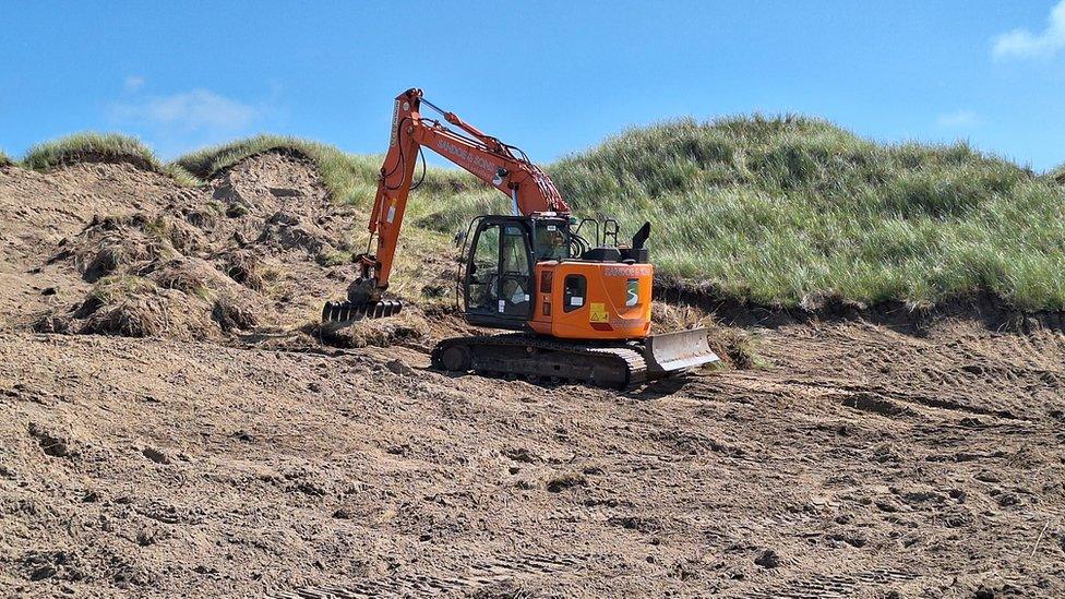 A digger at Penhale Dunes