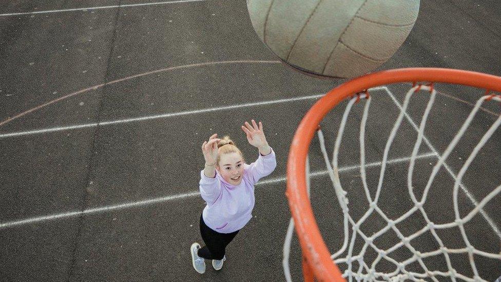 Girl scores netball goal