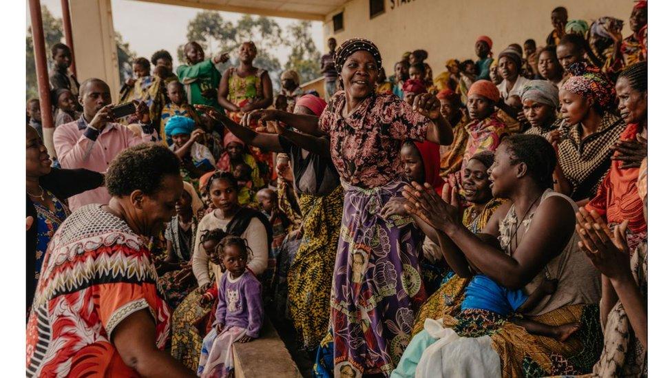 Women in Congo speaking and celebrating together