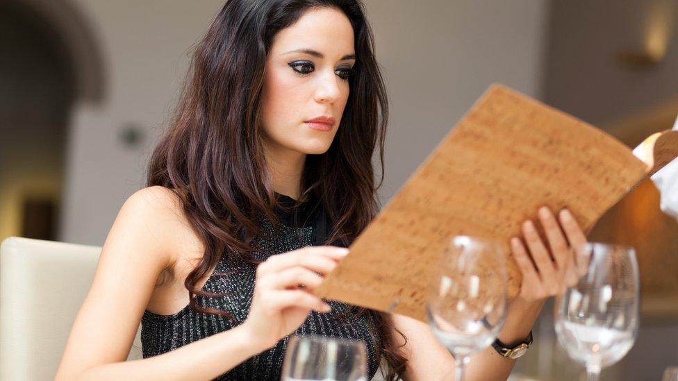 Women looking at wine list