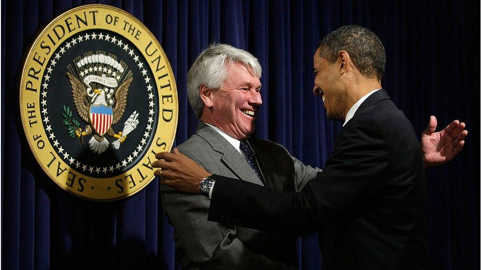 U.S. President Barack Obama (R) greets White House counsel Gregory Craig (L) during an event at the Eisenhower Executive Office Building of the White House January 21, 2009 in Washington.