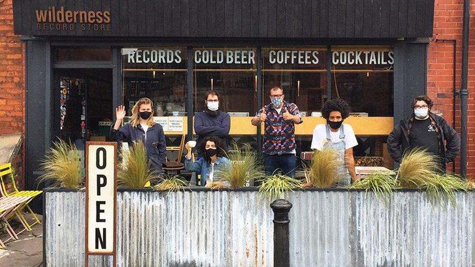 Wilderness records staff outside the shop