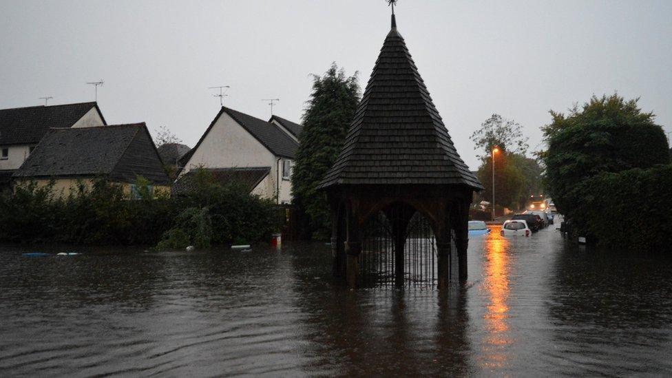 Flooded Bovingdon high street in Hertfordshire