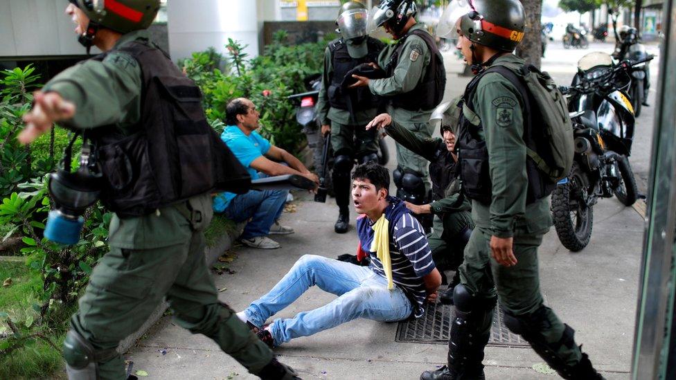 A demonstrator is detained at a protest against President Nicolas Maduro in Caracas, Venezuela, July 27, 2017