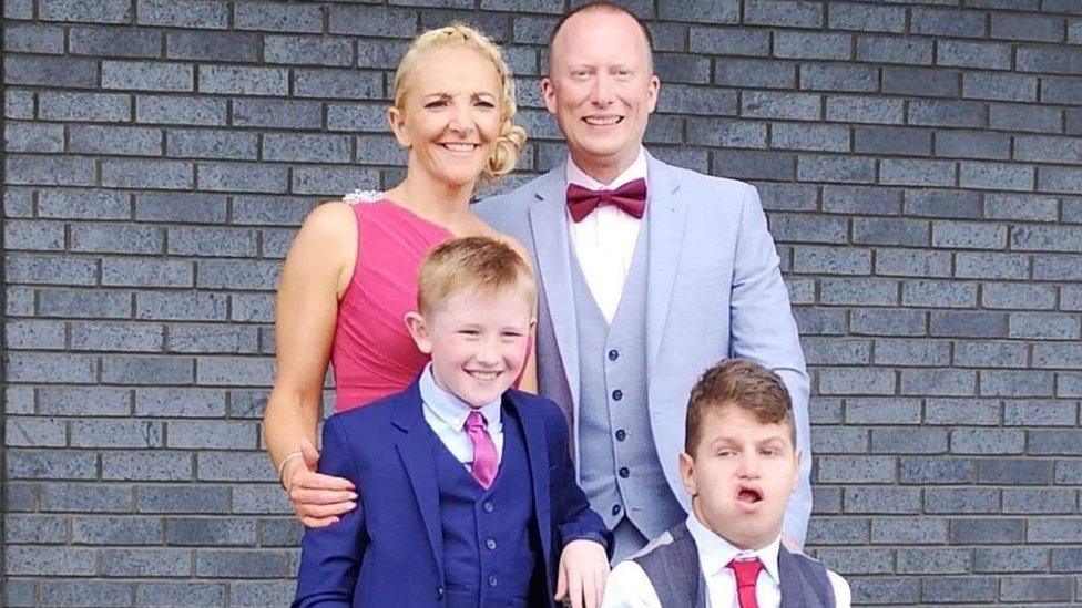 Louis Rawlinson pictured with his family