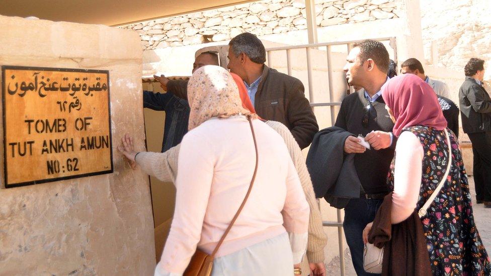 People gather outside the newly restored tomb of King Tutankhamun in the Valley of the Kings, Egypt (31 January 2019)