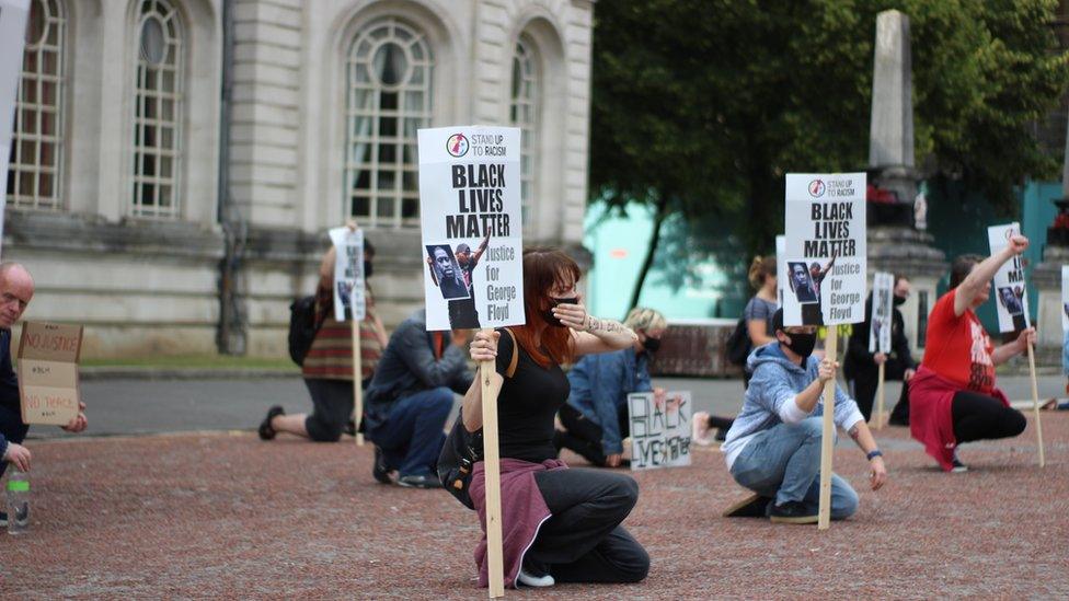 People took the knee outside City Hall as part of the Black Lives Matters movement