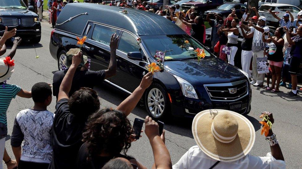 Onlookers throw flowers at hearse - 10 June