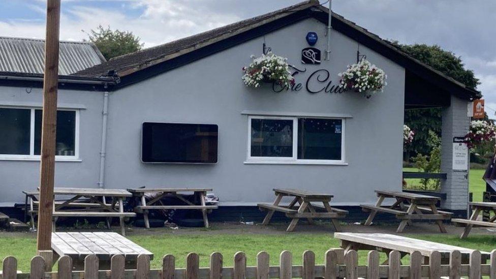 The Club at Tuffley Park, a social club with picnic benches out the front