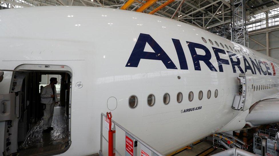 a man inside a plane in a building