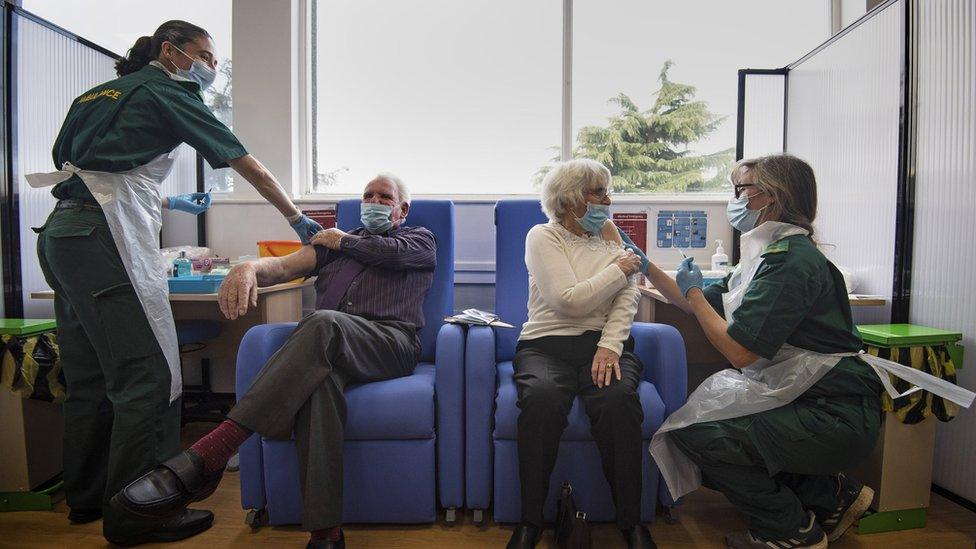 Husband and wife Vic and Penny Griffiths receive the Pfizer/BioNTech covid-19 vaccine at Basildon University Hospital, in Basildon, Essex, as the largest ever immunisation programme in the UK"s history continues.