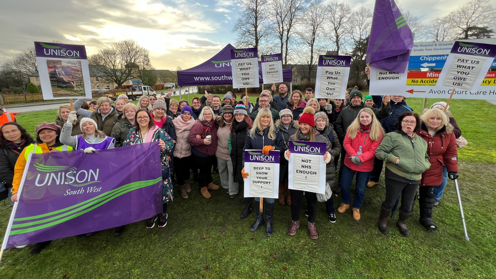 Workers on a picket line outside a community hospital