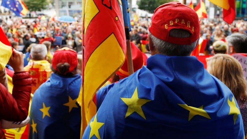 Spanish protesters draped with EU flags in Brussels. File photo