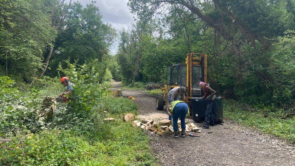 Volunteers working on a path