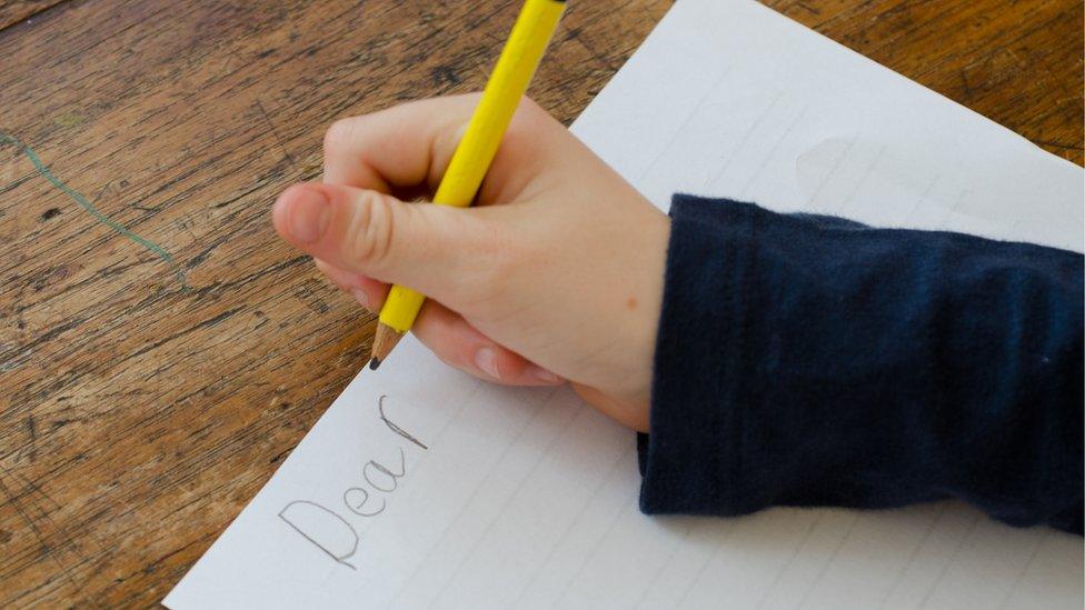 Child writing a letter