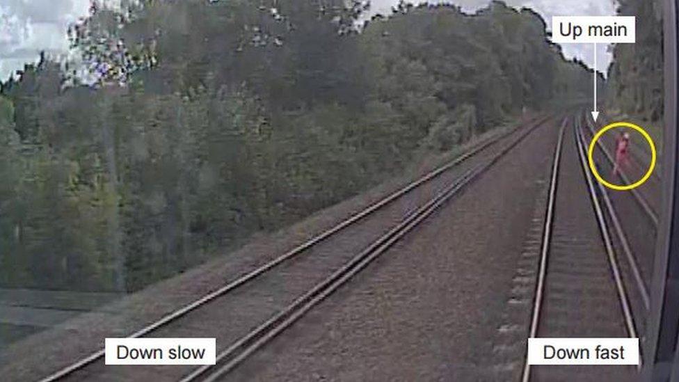 The track worker on the line as pictured by the CCTV camera on the train