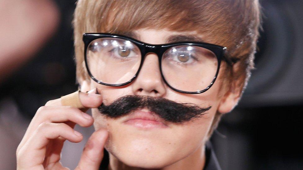 Justin Bieber in a detective outfit