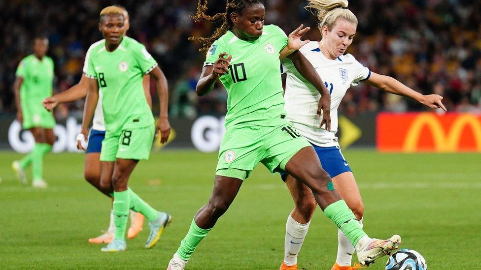 Nigeria's Christy Ucheibe and England's Lauren Hemp (right) battle for the ball during the FIFA Women's World Cup