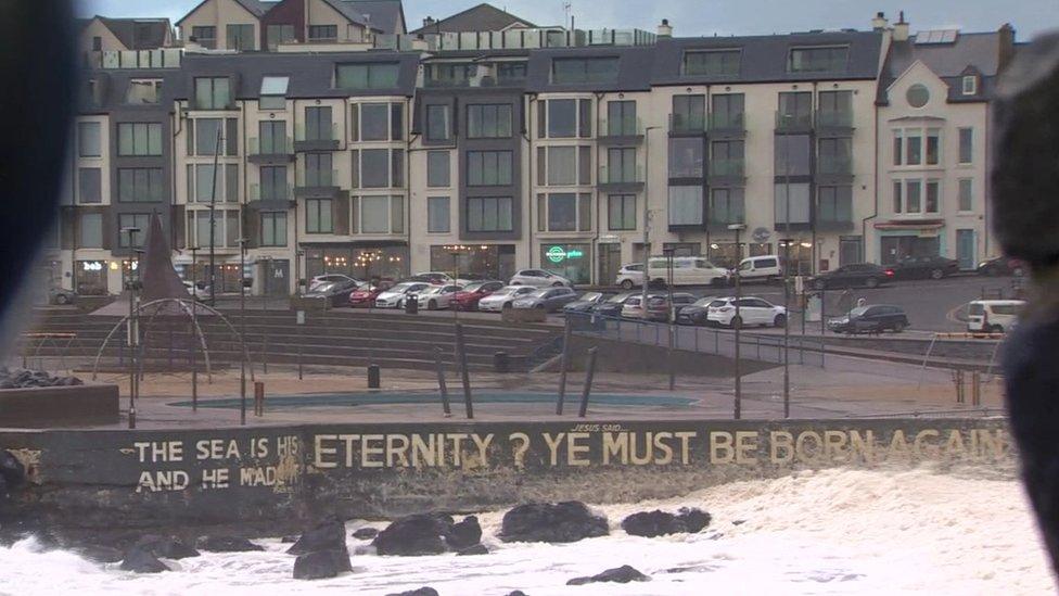 The words "Eternity? Ye must be born again" painted on the seawall in Portstewart