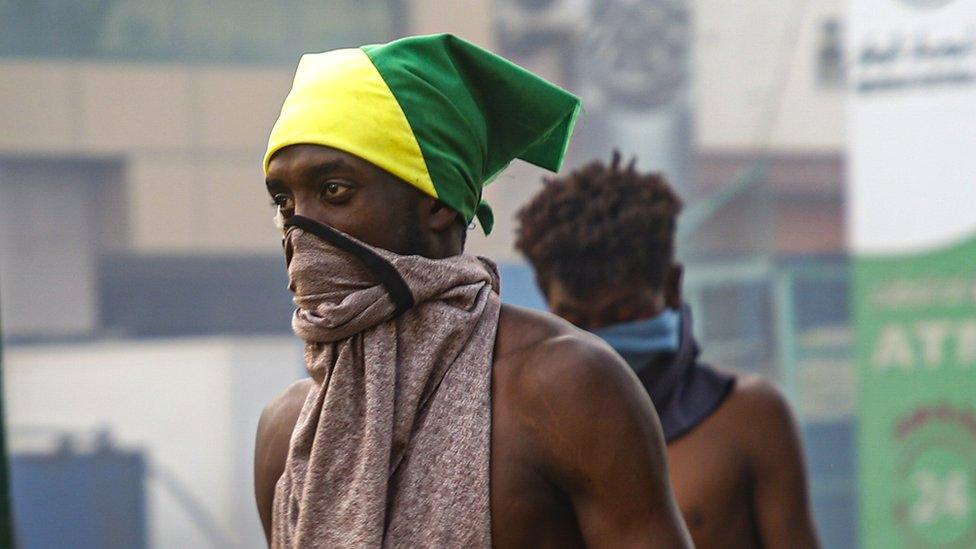 Sudanese protesters clash with security forces during an anti-coup protest near the presidential palace in the capital Khartoum, Sudan, 25 December 2021