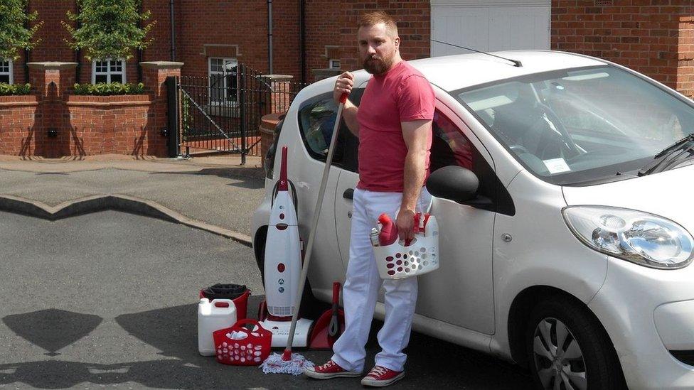 Domestic Cleaning Alliance director Stephen Munton stands with his mop