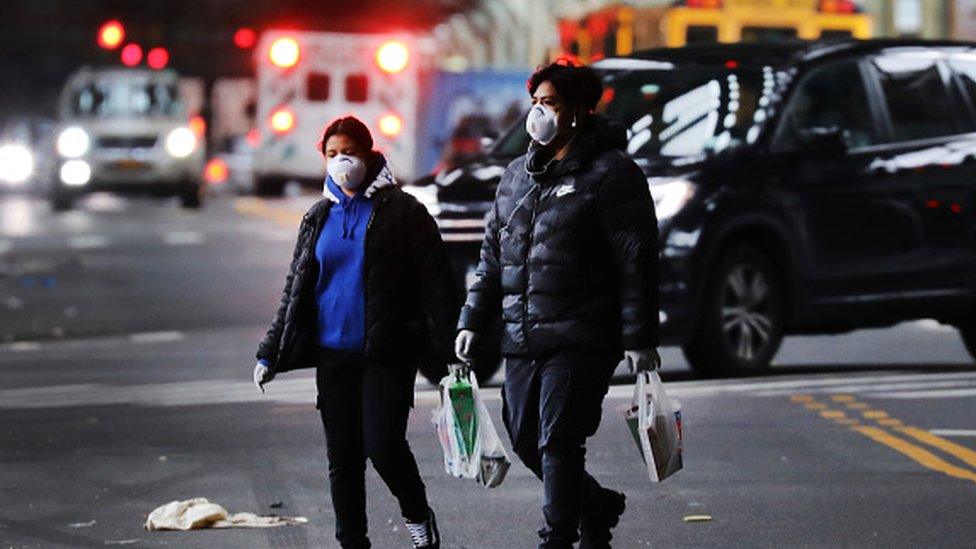 People walk through the streets of Brooklyn which has seen an upsurge of coronavirus patients