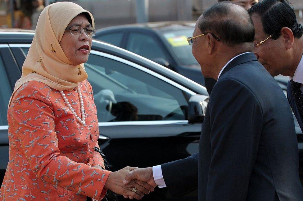 Singaporean Member of Parliament (MP) and National Trades Union Congress Assistant Secretary-General, Halimah Yacob (L) shakes hands with Cambodian President of National Assembly Heng Samrin (R) upon her arrival at the National Assembly building in Phnom Penh on 7 May 2015.