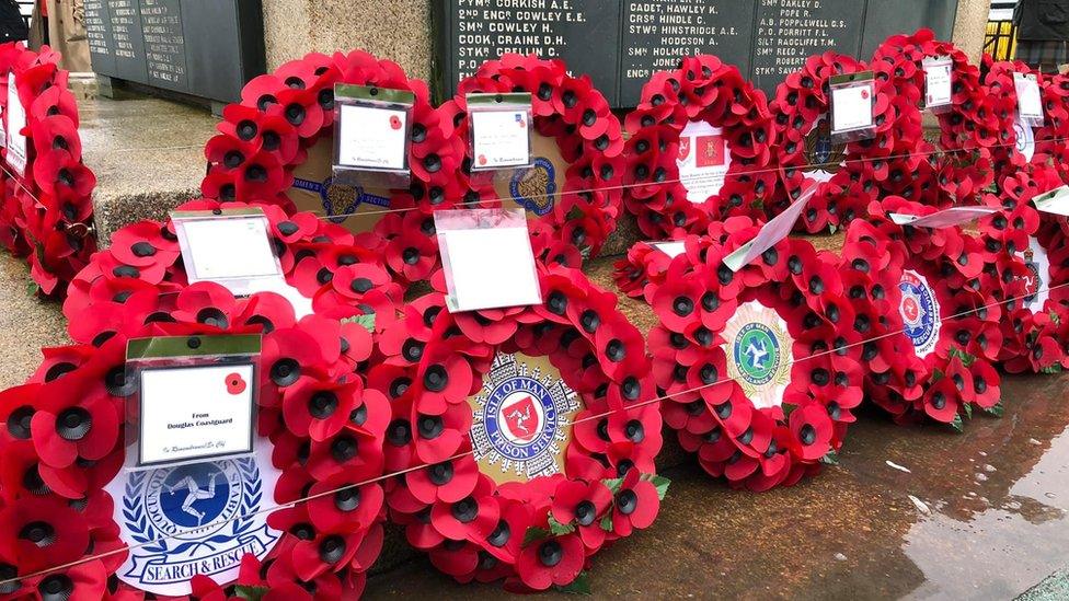 Wreaths at the foot of Douglas war memorial