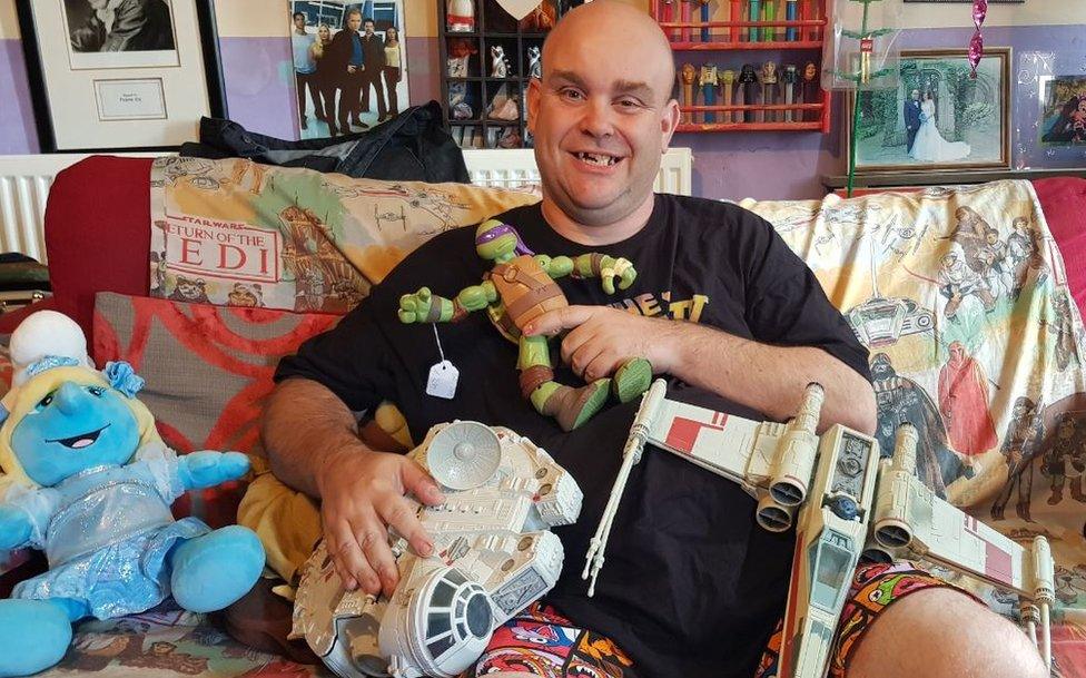 JJ Lucia-Wright with some of the donated toys