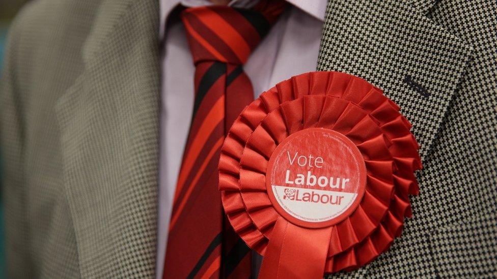 Man wearing Labour rosette