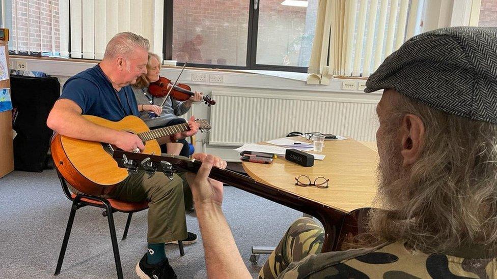 A music therapy session at the service