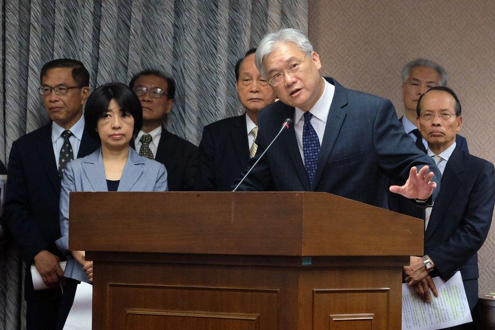 Andrew Hsia (3rdR), Minister of Mainland Affairs Council, gestures while speaking to a lawmaker at the Interior Committee of the Parliament on 13 April 2016